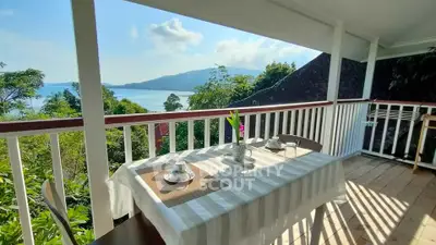 Stunning balcony with breathtaking sea view, perfect for outdoor dining and relaxation.
