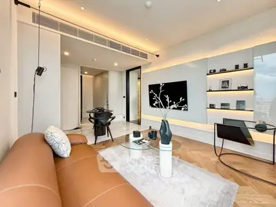 Modern living room with sleek design, leather sofa, and city view