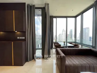 Luxurious corner unit living room with panoramic city views and modern furnishings.