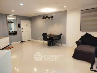 Spacious modern living room with sleek furniture and elegant lighting