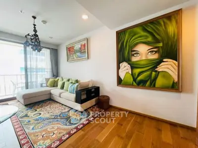 Stylish living room with large artwork and cozy seating area