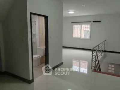 Spacious modern interior with bathroom and bright open area