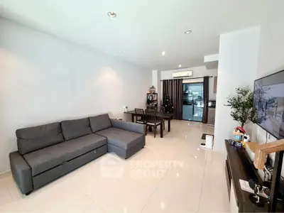 Spacious modern living room with sleek furniture and open layout