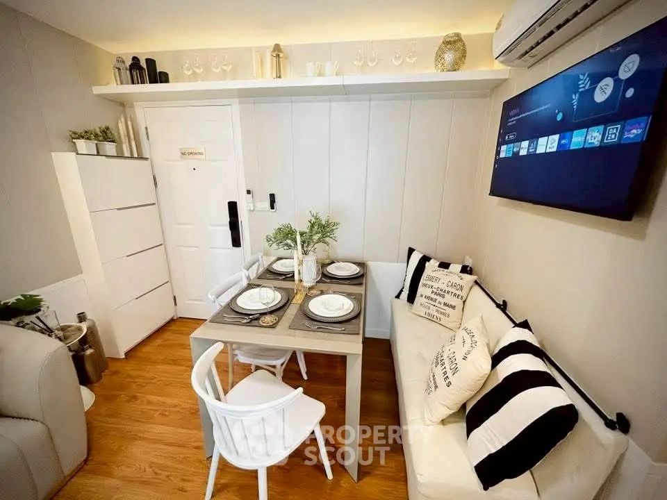 Chic and cozy living room with modern decor and dining setup, perfect for urban living.