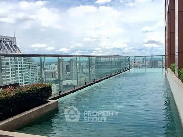 Luxurious rooftop infinity pool with stunning city skyline view