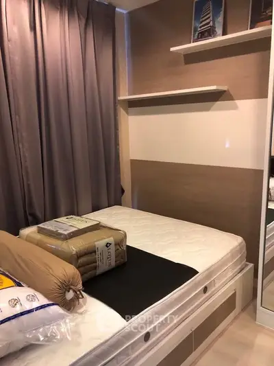 Cozy bedroom with modern decor and ample storage space, perfect for urban living.