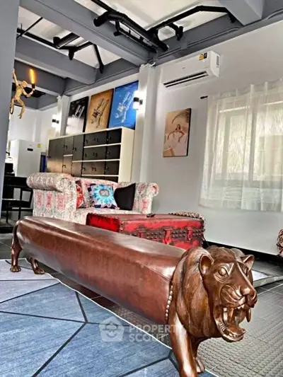 Stylish living room with unique lion bench and eclectic decor