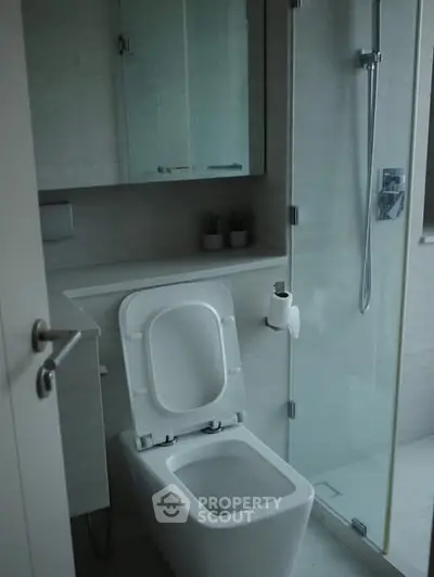 Modern bathroom with sleek design and glass shower enclosure