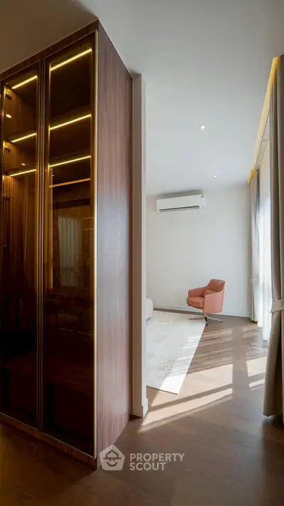 Modern living room with wooden flooring and stylish furniture