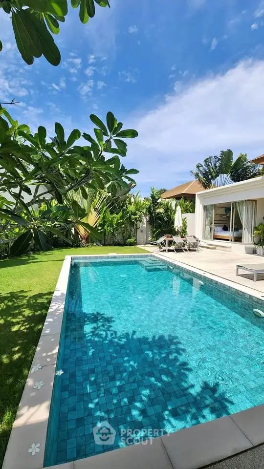 Luxurious villa with private pool and lush garden, perfect for relaxation and entertainment.