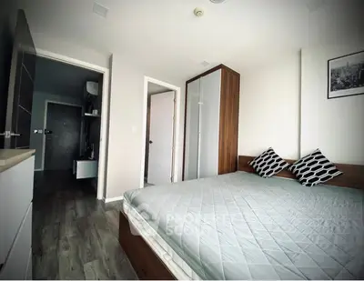 Modern bedroom with stylish decor and ample natural light