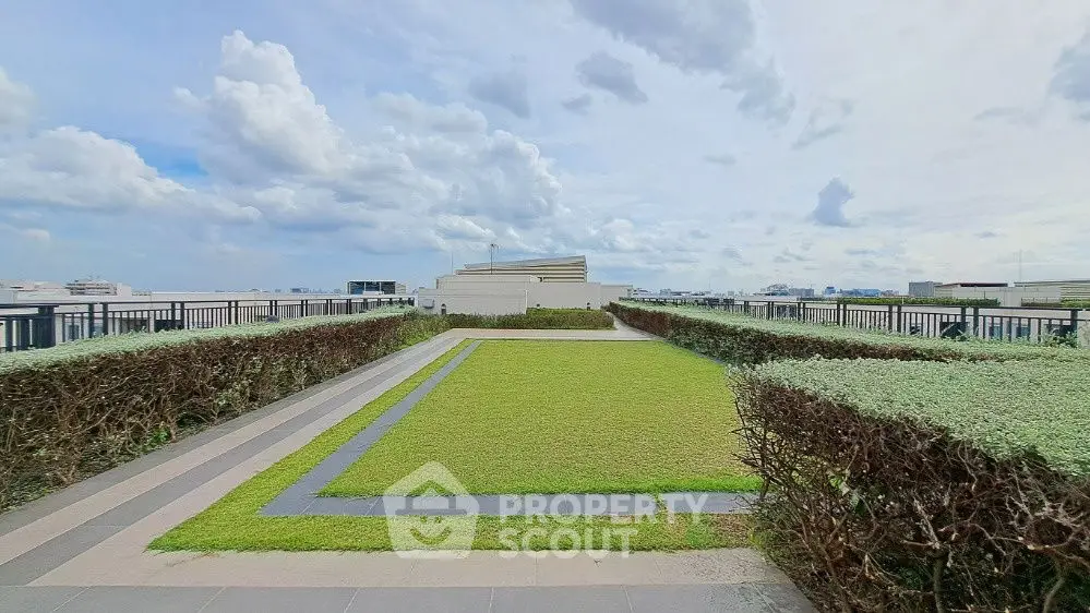 Stunning rooftop garden with panoramic city views and lush greenery.