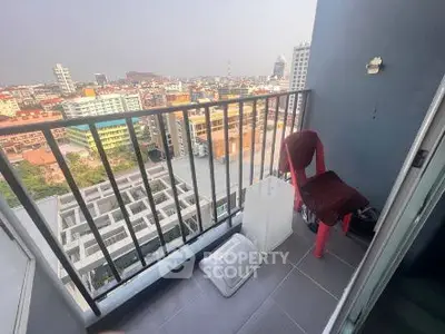 Charming city view from a cozy balcony with seating area