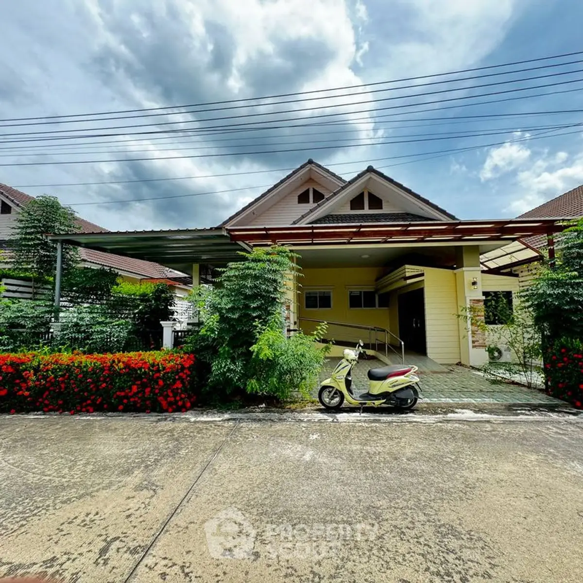 Charming suburban home with lush garden and covered parking area.