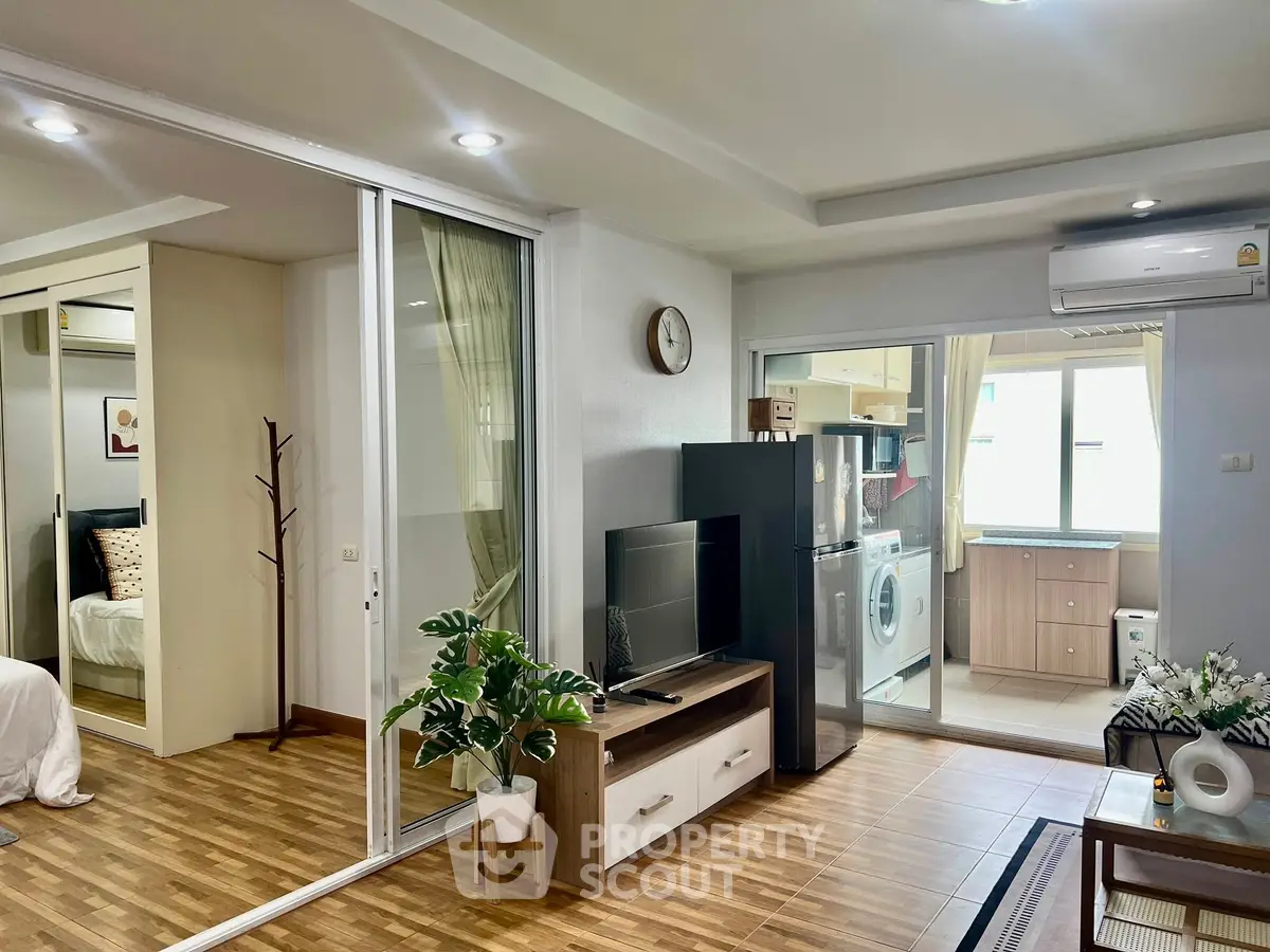 Modern open-plan living room with stylish decor and natural light