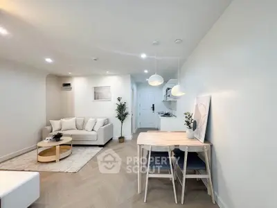 Modern living room with cozy seating and stylish dining area