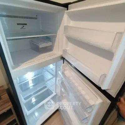 Spacious modern refrigerator with ample storage in a sleek kitchen setting.