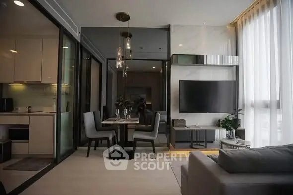 Modern living room with sleek design and open kitchen layout