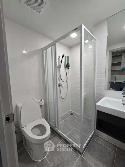 Modern bathroom with glass shower and sleek fixtures