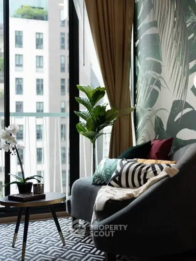 Stylish living room with modern decor and large windows offering city views.