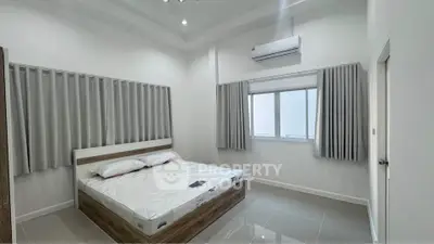 Modern minimalist bedroom with sleek design and natural light