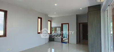 Spacious modern interior with sleek design and ample natural light, perfect for contemporary living.