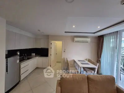 Modern open-layout kitchen and dining area with sleek design and natural light.