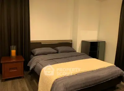 Cozy bedroom with modern furnishings and warm lighting, perfect for relaxation and comfort.
