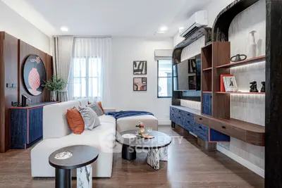 Stylish modern living room with elegant decor and cozy seating area, perfect for relaxation and entertainment.