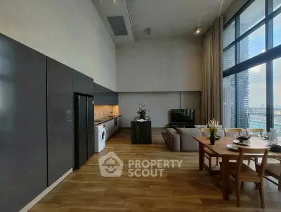 Spacious modern living room with high ceilings and city view