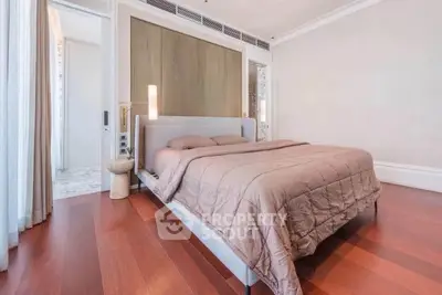 Luxurious bedroom with elegant wooden flooring and modern decor