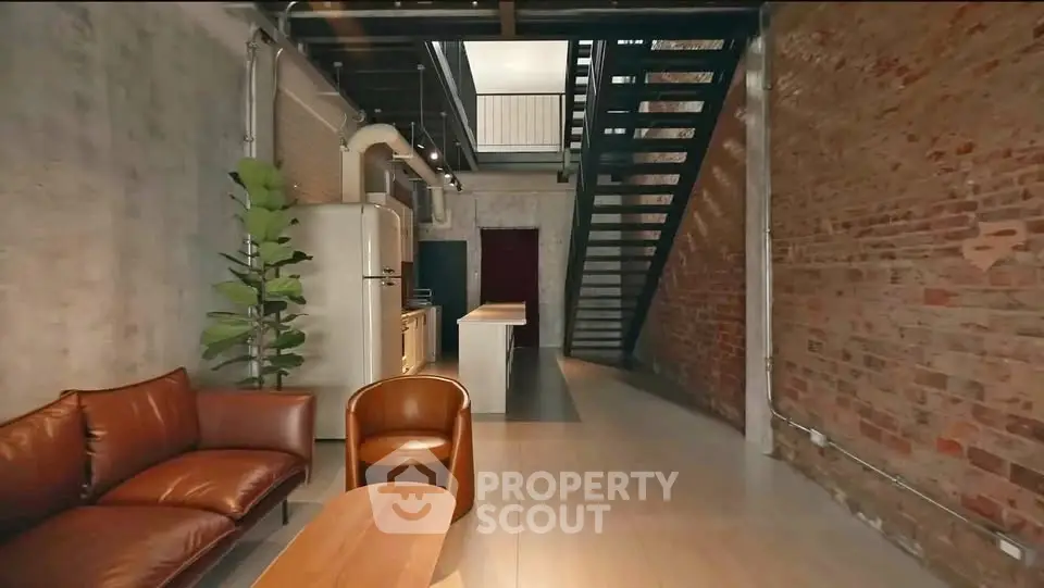 Stylish industrial loft with exposed brick and modern furniture