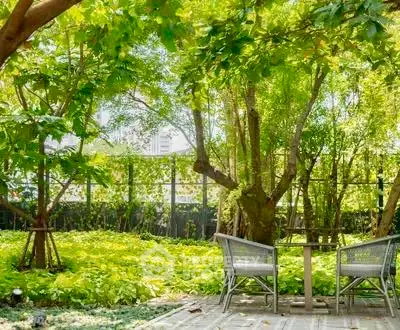 Lush garden with seating area, perfect for relaxation and outdoor enjoyment.