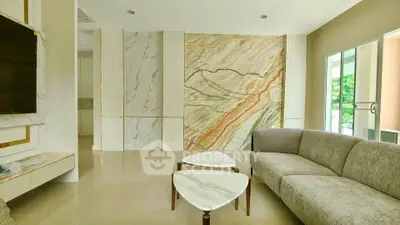 Luxurious living room with elegant marble accents and modern furniture