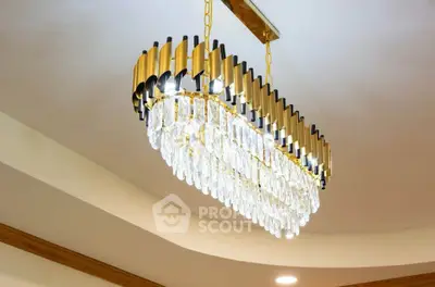Elegant chandelier with crystal accents in a luxurious interior setting