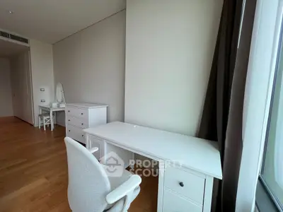 Spacious study room with elegant white furniture and natural light