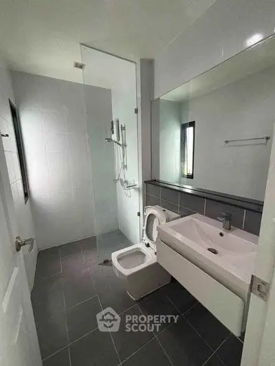 Modern bathroom with sleek design and glass shower enclosure