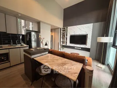 Modern living room with open kitchen, marble dining table, and stylish decor in a contemporary apartment.