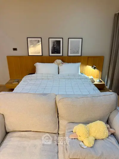 Cozy bedroom with stylish decor and plush bedding, perfect for relaxation and comfort.