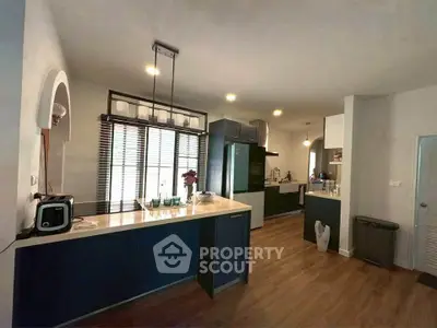 Modern kitchen with sleek design, featuring open layout and stylish appliances, perfect for culinary enthusiasts.