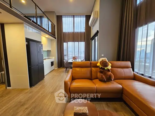 Luxurious high-ceiling living room with modern decor and city view