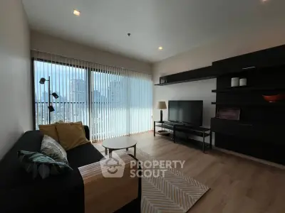 Modern living room with city view, stylish furniture, and natural light.