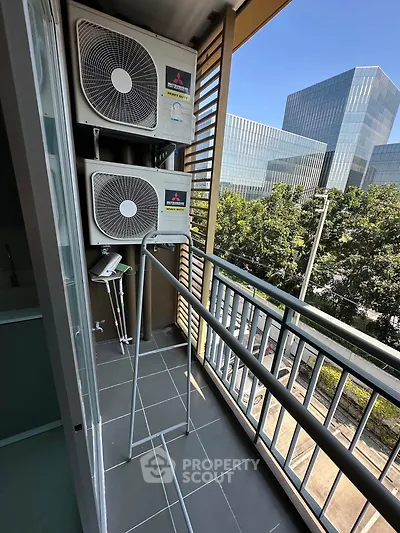 Modern balcony with air conditioning units and city view, perfect for urban living.
