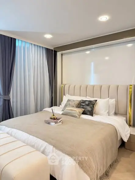 Luxurious bedroom with elegant decor and plush bedding