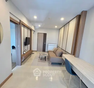 Modern living room with stylish furniture and open layout, perfect for relaxation and entertainment.
