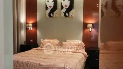 Cozy bedroom with modern decor and stylish artwork above the bed.