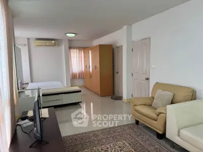 Spacious studio apartment with modern furnishings and natural light