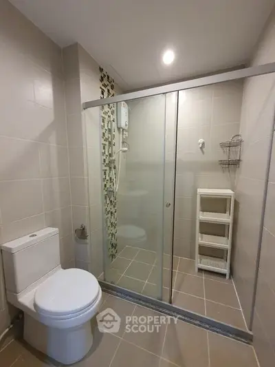 Modern bathroom with glass shower and sleek tile design