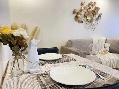 Elegant dining setup with modern decor and cozy living room ambiance.