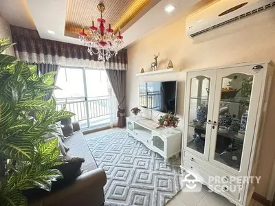 Elegant living room with plush seating, ornate chandelier, and a large window allowing ample natural light, perfect for sophisticated urban living.